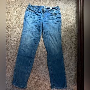 DKNY dark blue jeans. they are low rise and fit a y2k vibe.